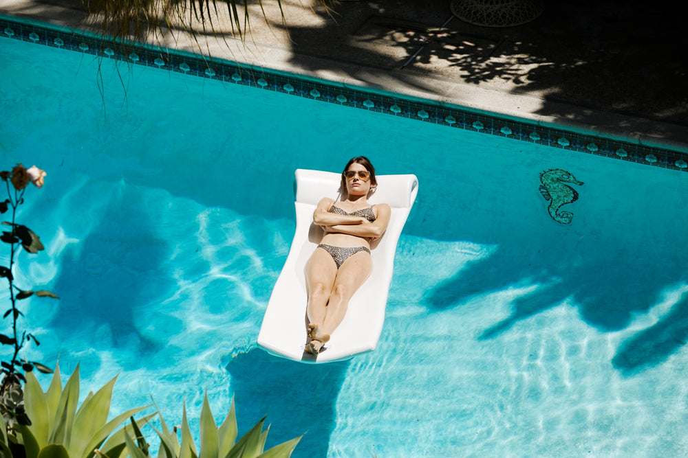 Girl floating in the pool