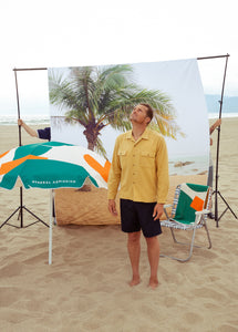 garrett leight x general admission beach umbrella and towel